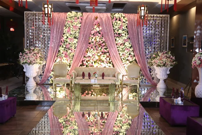 Bridal stage with chandelier and royal chairs